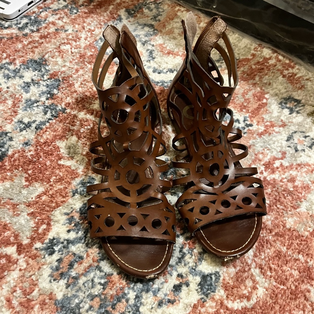 Brown leather gladiator style sandals by Guess